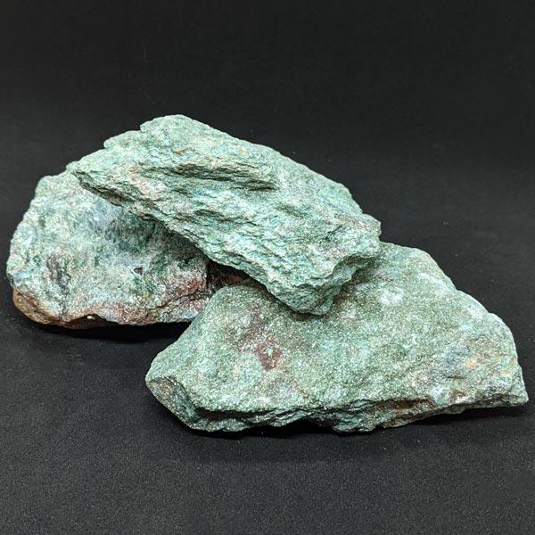Chunks of raw Fuschite mineral