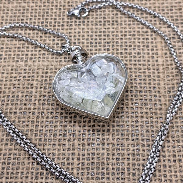 Prehnite chips in beveled glass heart necklace